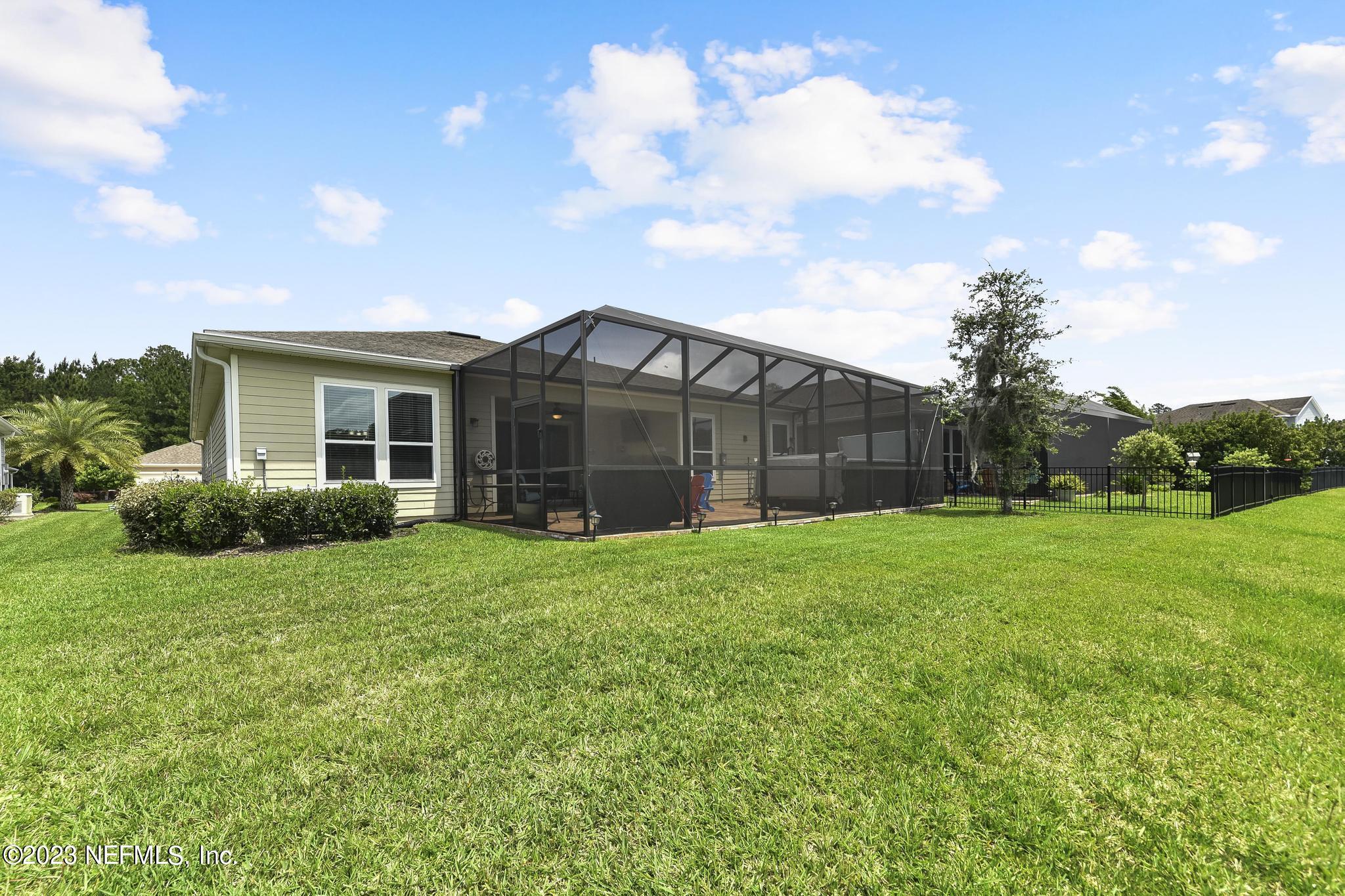 168 St Kitts Loop St. Augustine, FL 32092 - Photo 29 of 41 a view of a house with backyard and garden