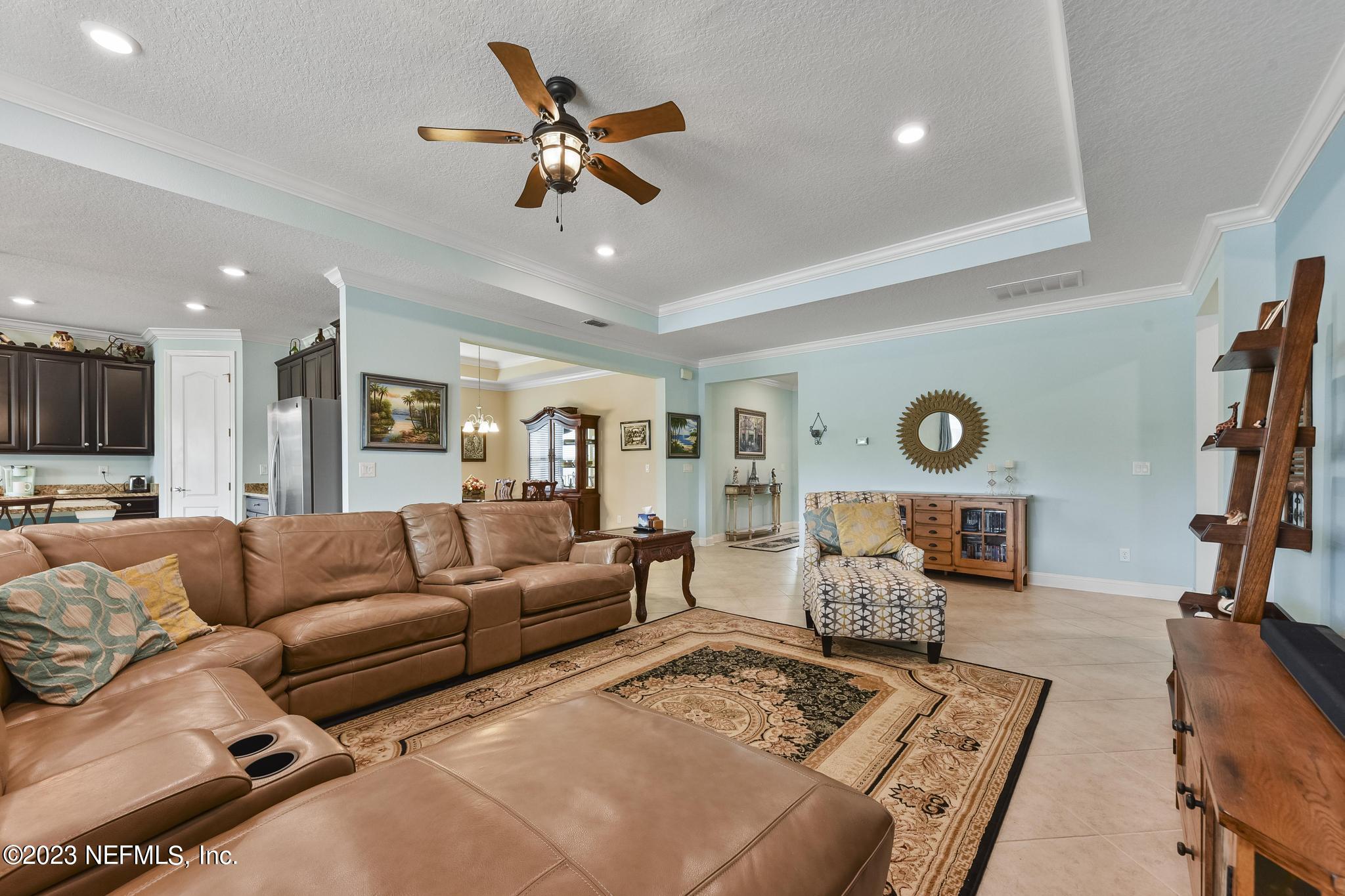 168 St Kitts Loop St. Augustine, FL 32092 - Photo 3 of 41 a living room with furniture kitchen view and a window