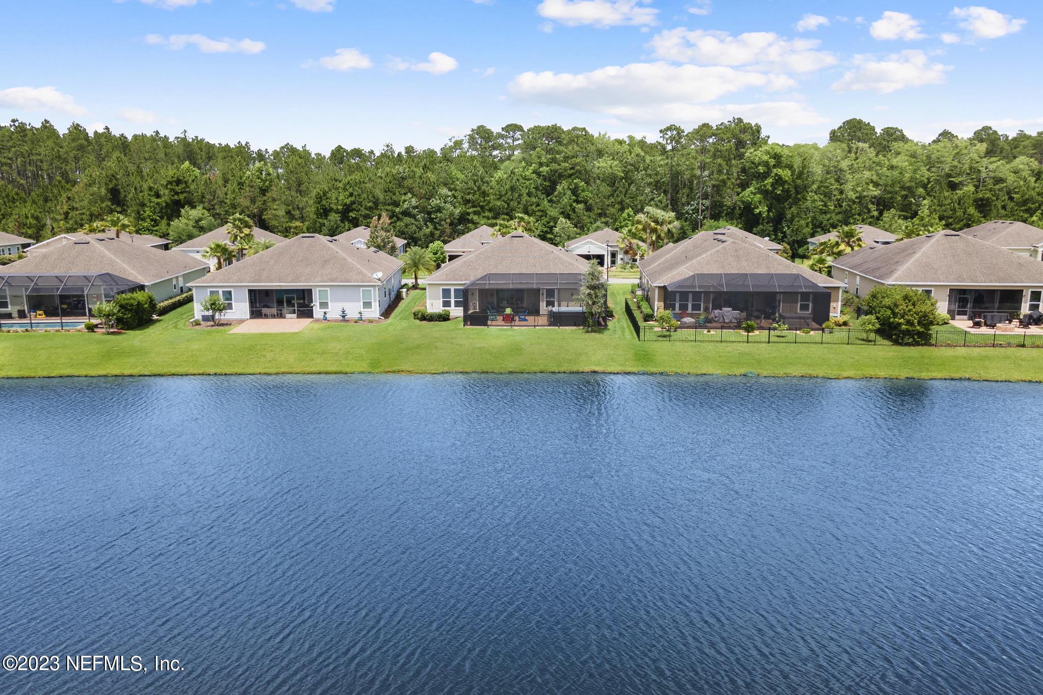 168 St Kitts Loop St. Augustine, FL 32092 - Photo 31 of 41 a view of house with garden and a yard