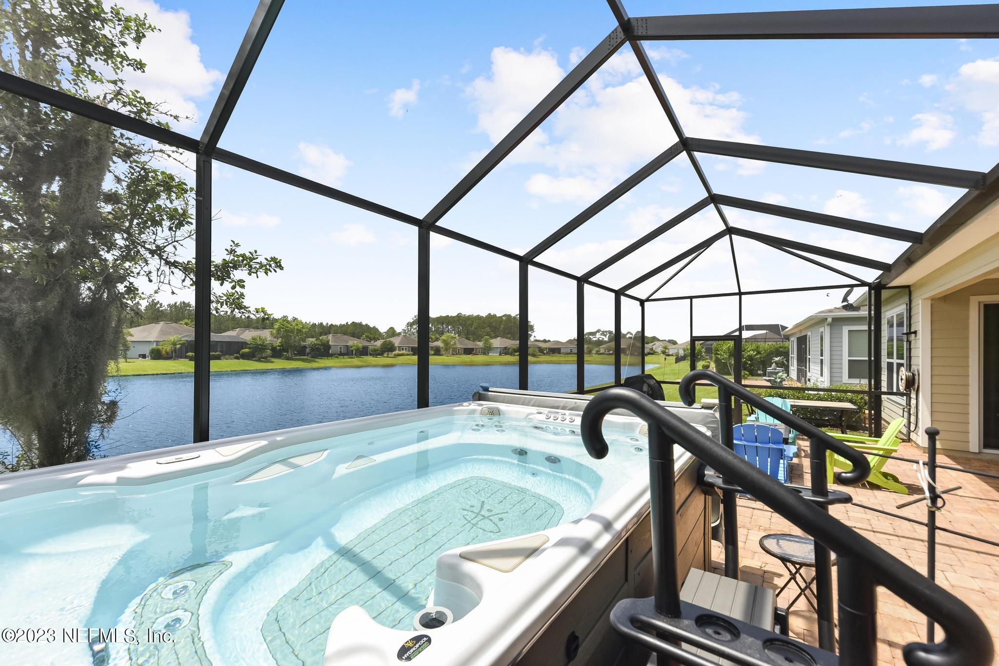 168 St Kitts Loop St. Augustine, FL 32092 - Photo 32 of 41 a swimming pool with lake view
