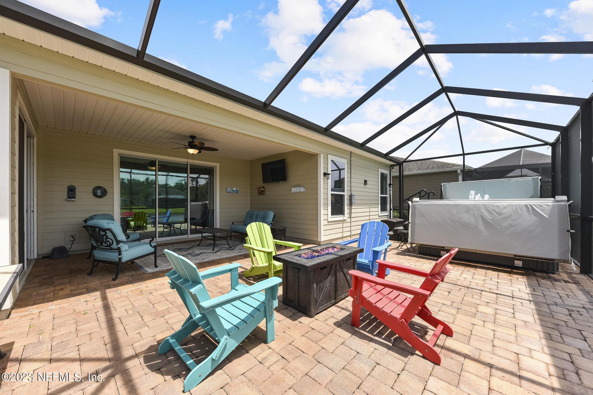 168 St Kitts Loop St. Augustine, FL 32092 - Photo 33 of 41 a outdoor living space with patio furniture and garden view