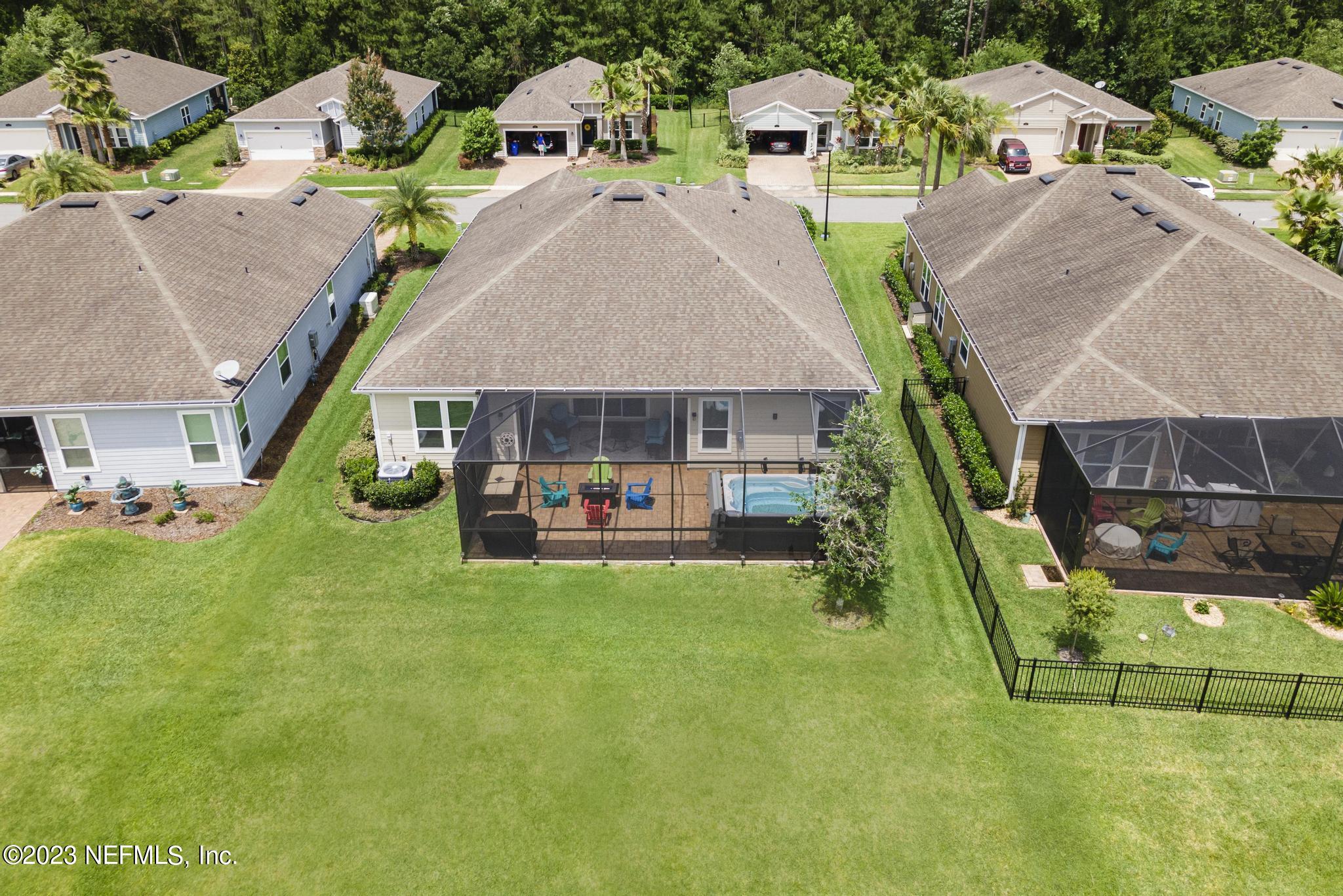 168 St Kitts Loop St. Augustine, FL 32092 - Photo 35 of 41 an aerial view of a house with swimming pool and garden