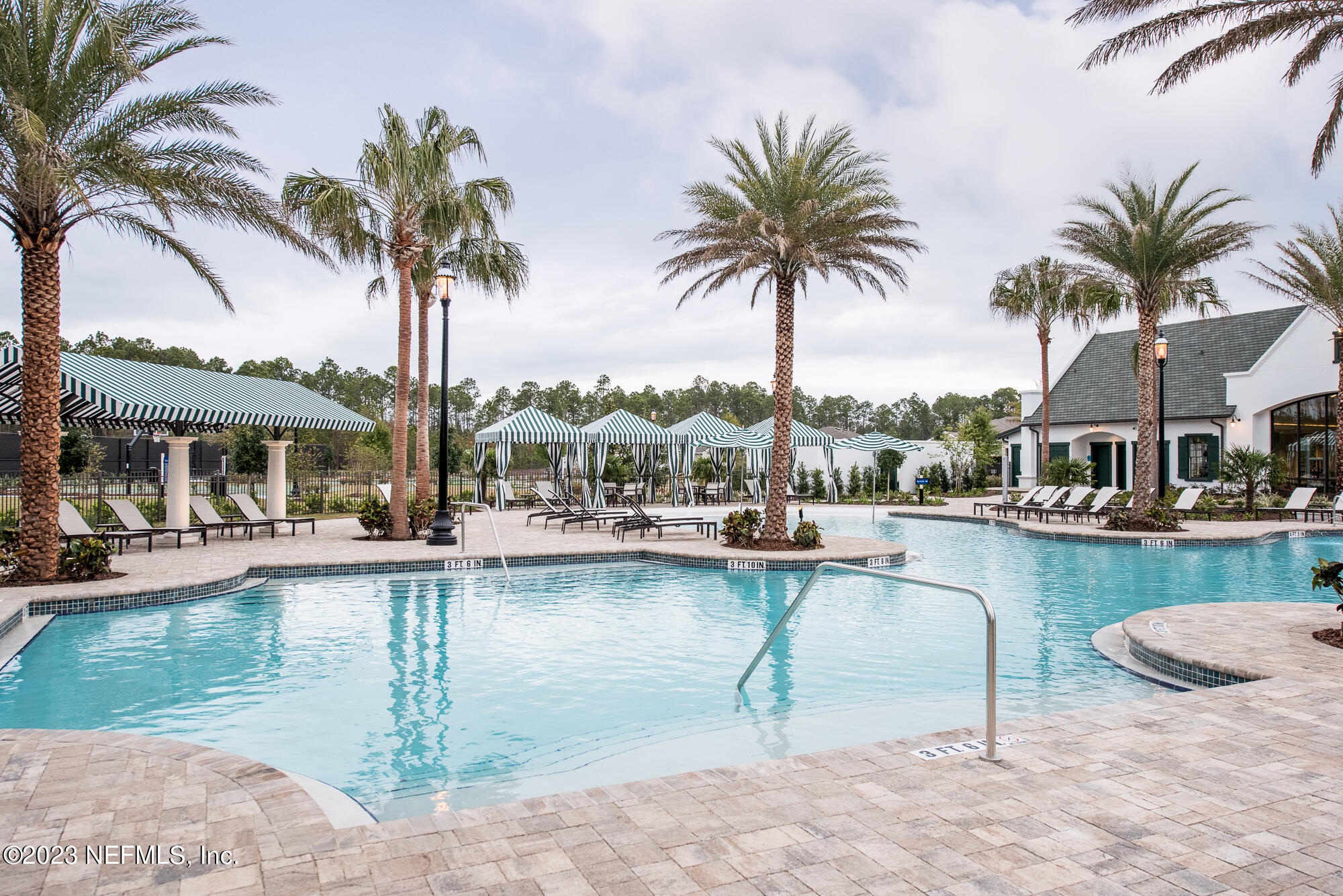 168 St Kitts Loop St. Augustine, FL 32092 - Photo 40 of 41 a swimming pool with outdoor seating and yard