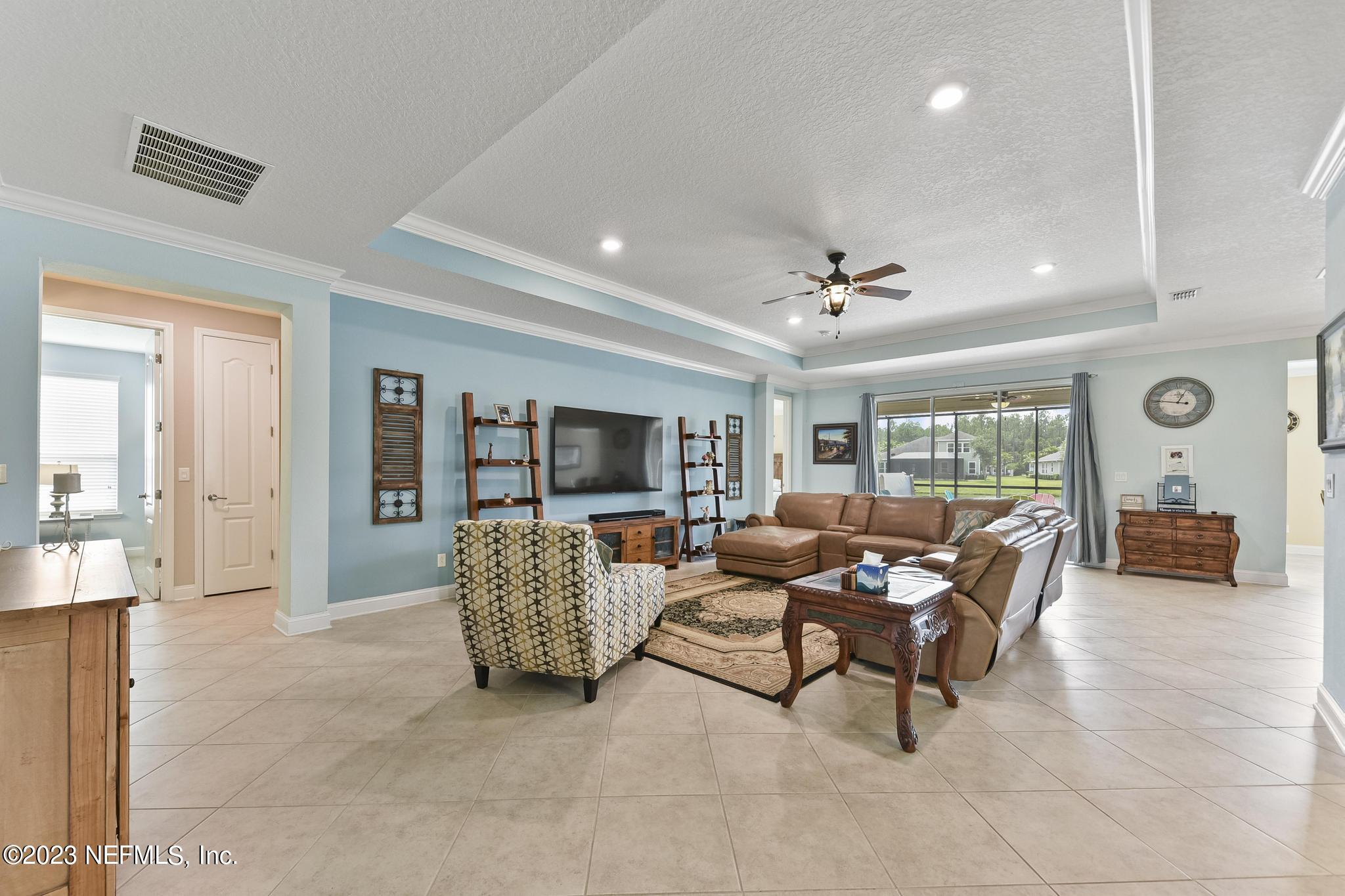 168 St Kitts Loop St. Augustine, FL 32092 - Photo 6 of 41 a living room with furniture and a large window