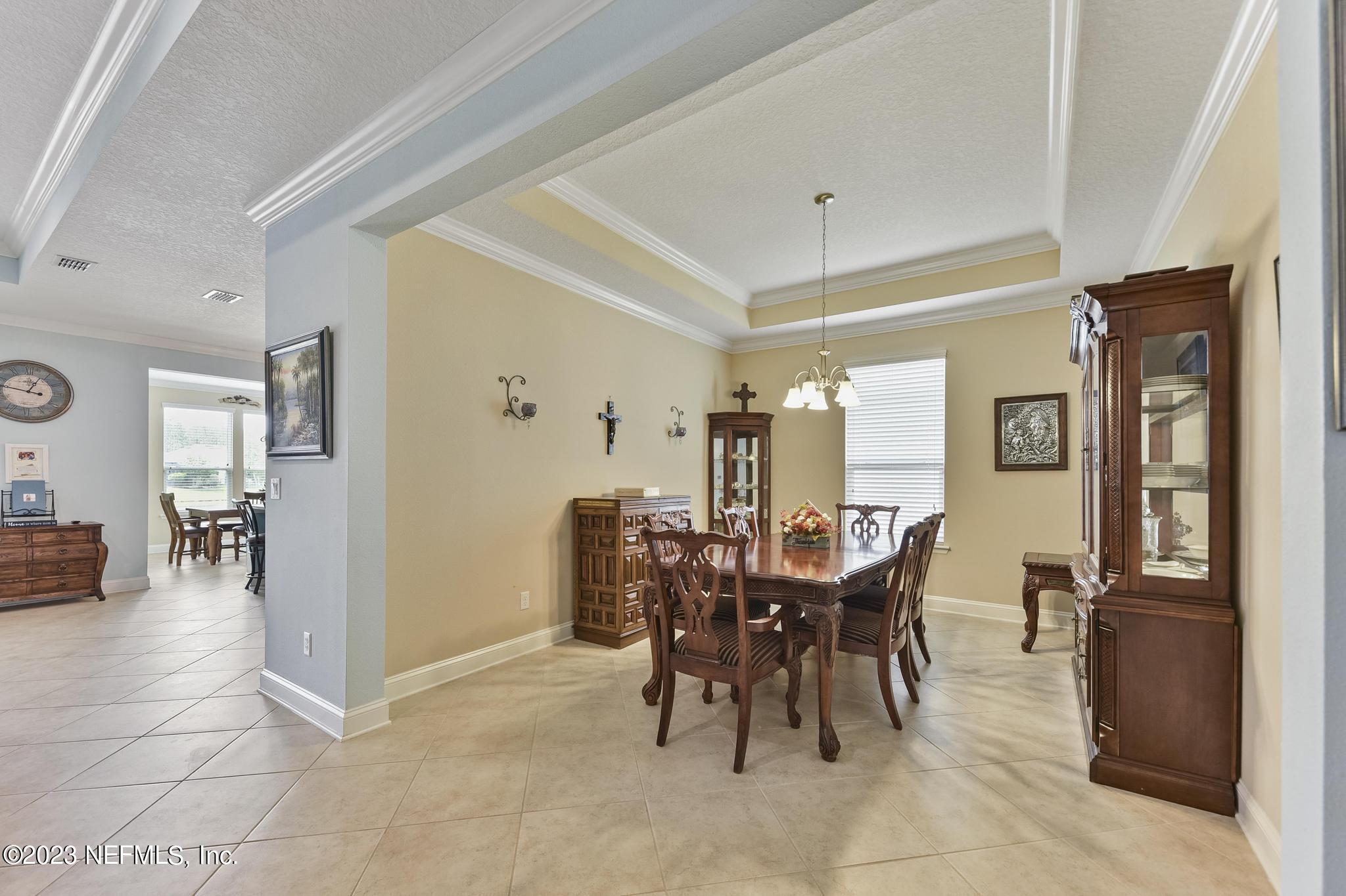 168 St Kitts Loop St. Augustine, FL 32092 - Photo 7 of 41 a view of a dining room with furniture