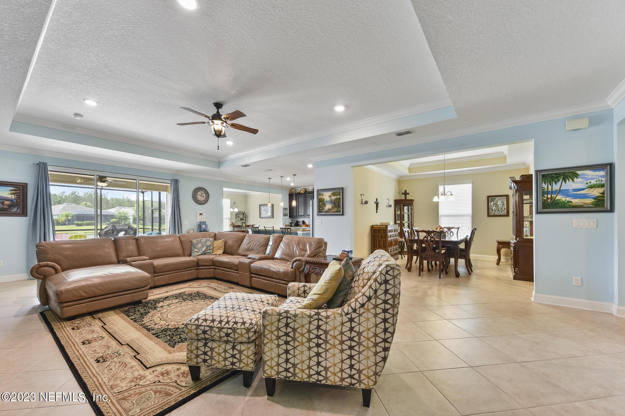 168 St Kitts Loop St. Augustine, FL 32092 - Photo 8 of 41 a living room with furniture and a large window