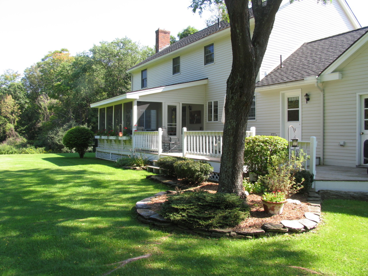 31 Old Barn Road Lenox, MA 01240 - Photo 3 of 56 a front view of a house with a yard and porch