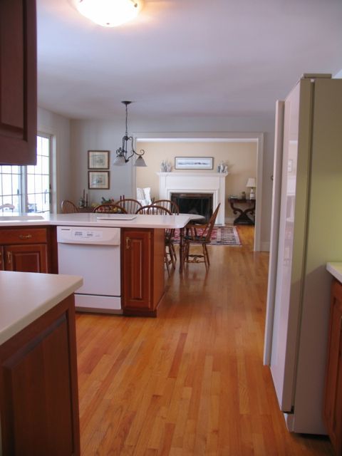 31 Old Barn Road Lenox, MA 01240 - Photo 27 of 56 a kitchen with stainless steel appliances granite countertop a refrigerator a sink dishwasher a stove and a dining table with wooden floor