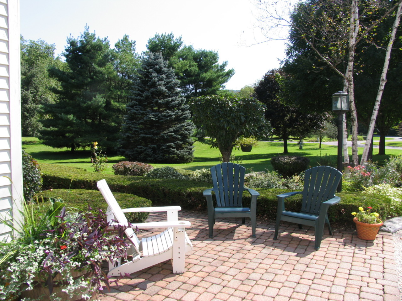 31 Old Barn Road Lenox, MA 01240 - Photo 4 of 56 a view of a table and chairs in the garden