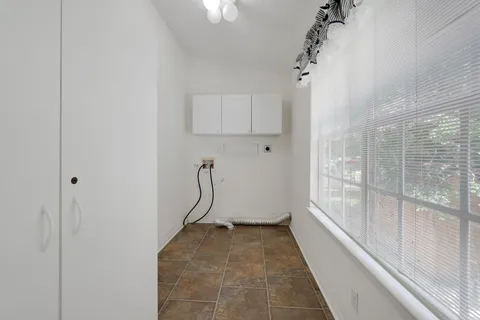 a view of a bathroom with a tub and shower