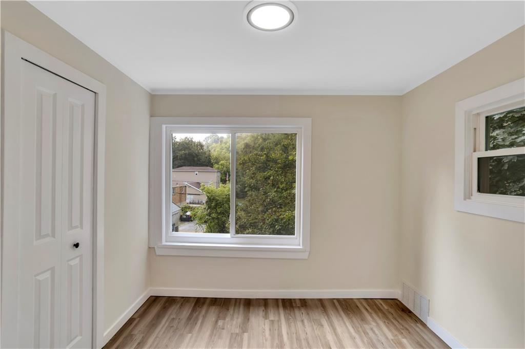 1430 Ridge Avenue Coraopolis, PA 15108 - Photo 18 of 32 a view of a room with wooden floor and windows