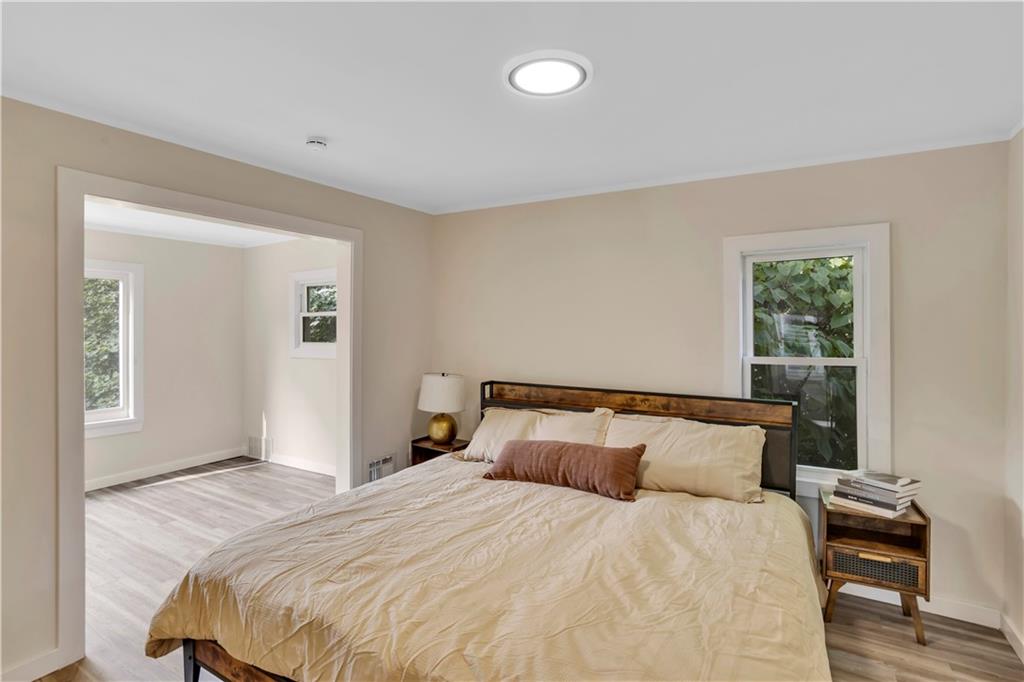 1430 Ridge Avenue Coraopolis, PA 15108 - Photo 19 of 32 a bedroom with a bed and wooden floor