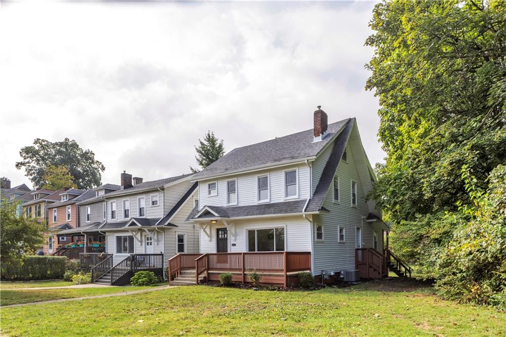 1430 Ridge Avenue Coraopolis, PA 15108 - Photo 2 of 32 a front view of a house with garden