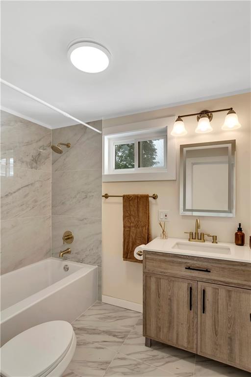 1430 Ridge Avenue Coraopolis, PA 15108 - Photo 22 of 32 a bathroom with a granite countertop sink toilet a large mirror and bathtub