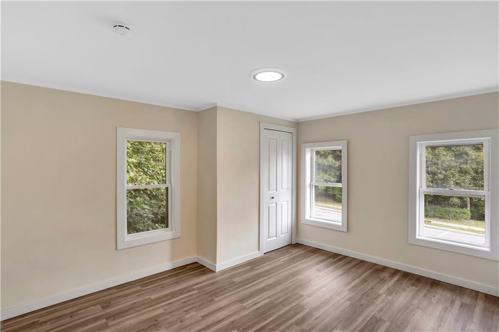 1430 Ridge Avenue Coraopolis, PA 15108 - Photo 23 of 32 a view of an empty room with wooden floor and a window