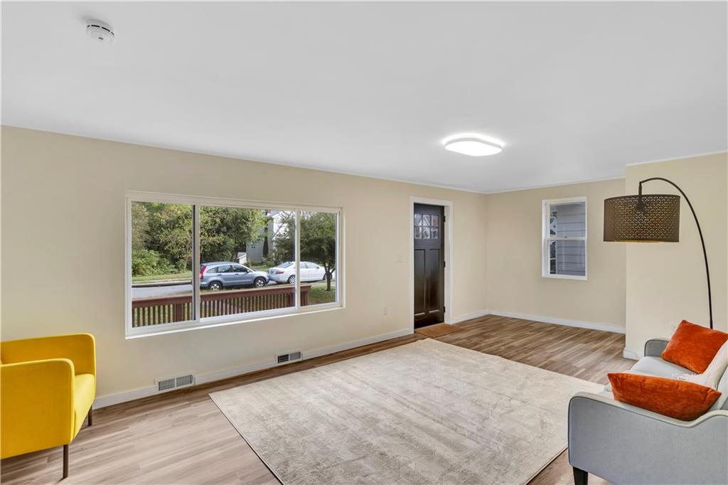 1430 Ridge Avenue Coraopolis, PA 15108 - Photo 6 of 32 a bedroom with a bed and wooden floor