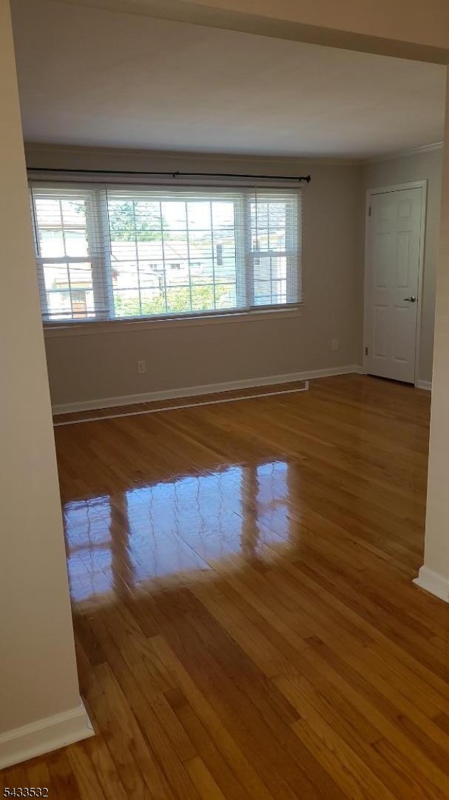16 Ocean Street Millburn, NJ 07041 - Photo 10 of 26 an empty room with wooden floor and windows
