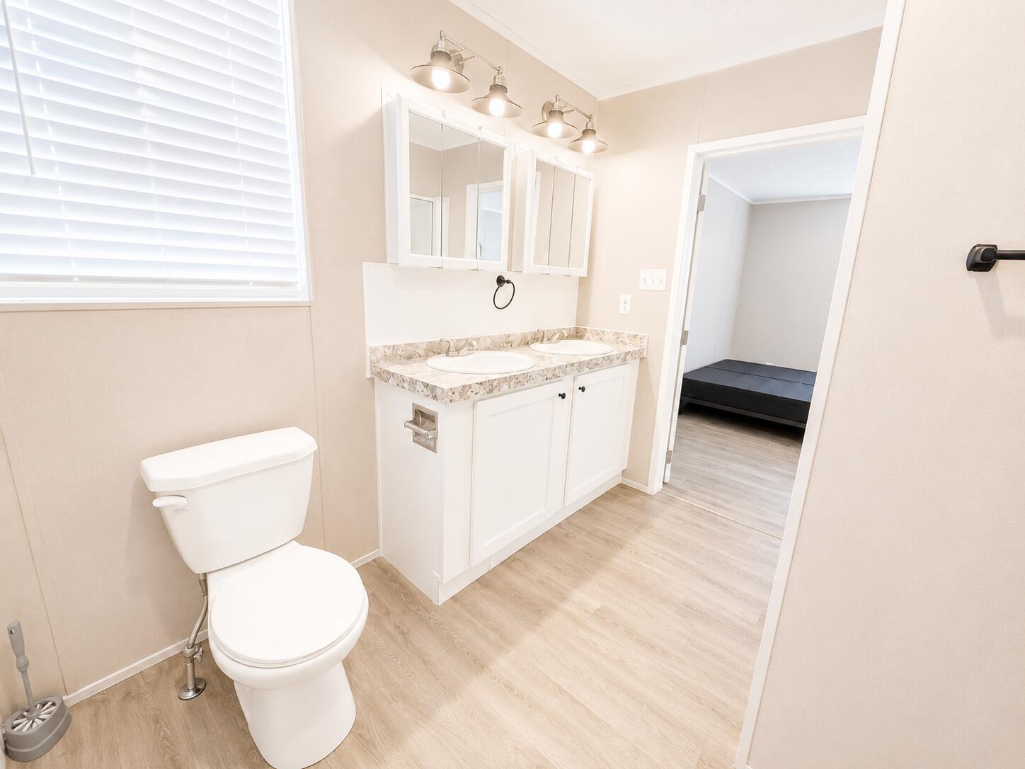 1121 Orange Loop Okeechobee, FL 34974 - Photo 22 of 33 Bright Modern Double-Vanity Bathroom