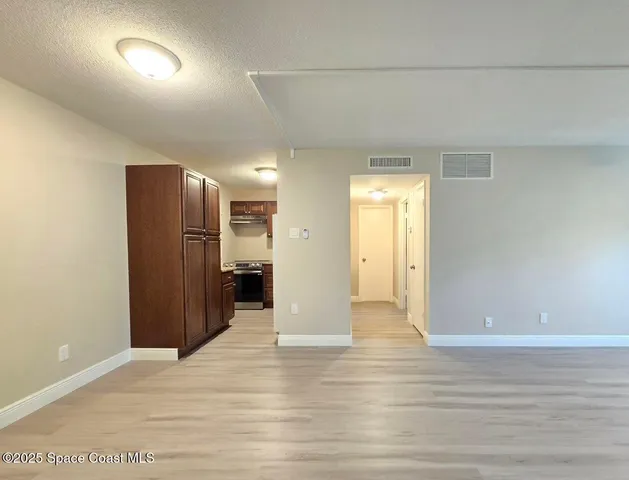 a view of a livingroom with wooden floor