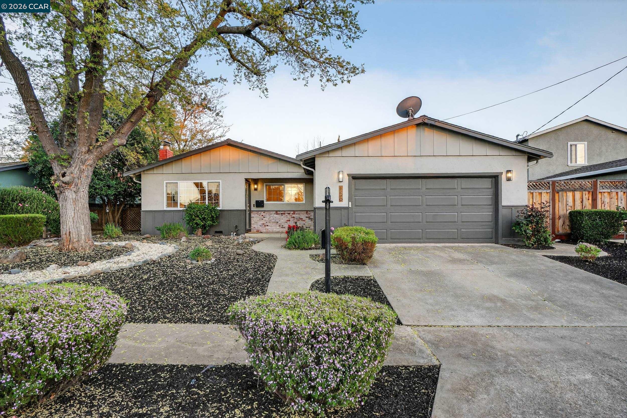 a front view of a house with garden