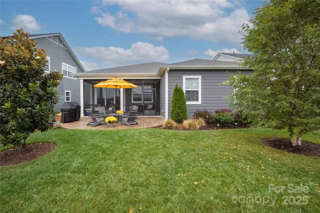 a view of a patio with table and chairs and potted plants