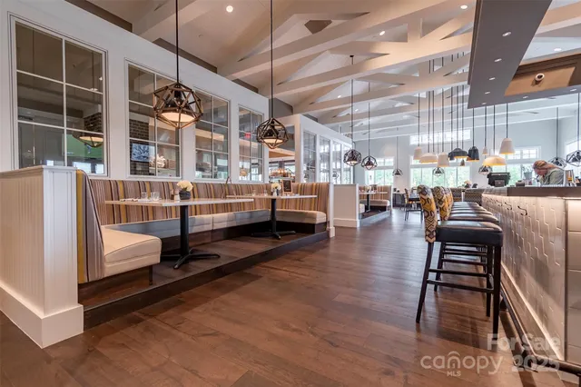 a view of a living room and kitchen