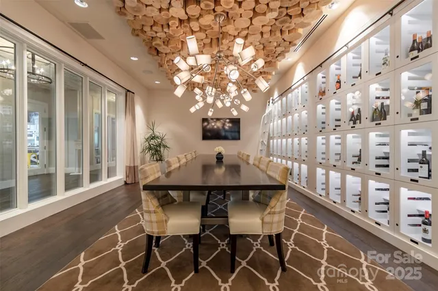 a view of a dining room with furniture and chandelier