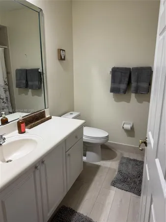 a view of a chairs and tables in the back yard of the house