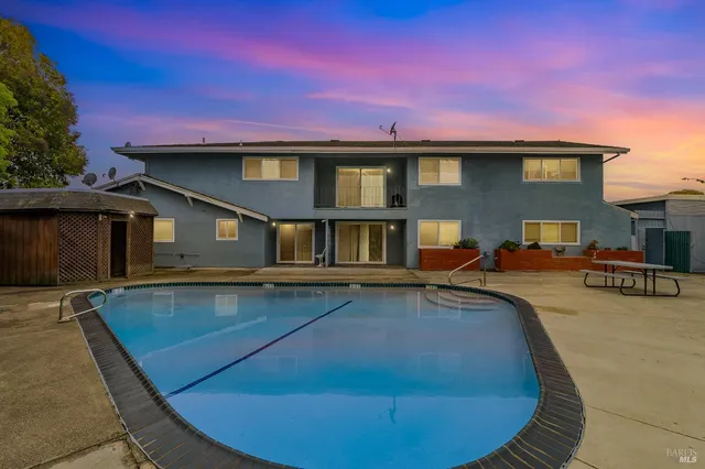 a view of a house with swimming pool