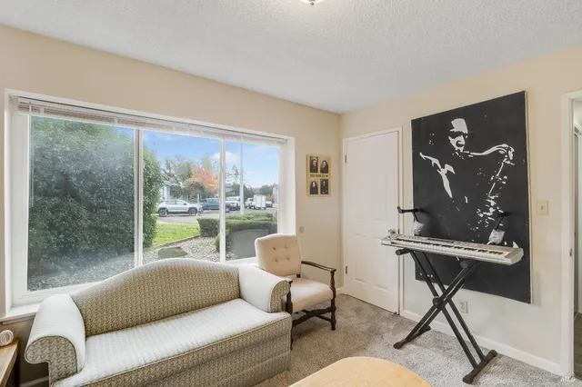 a view of an empty room with a fan