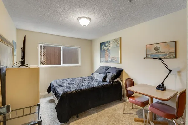 a view of an empty room with a fan