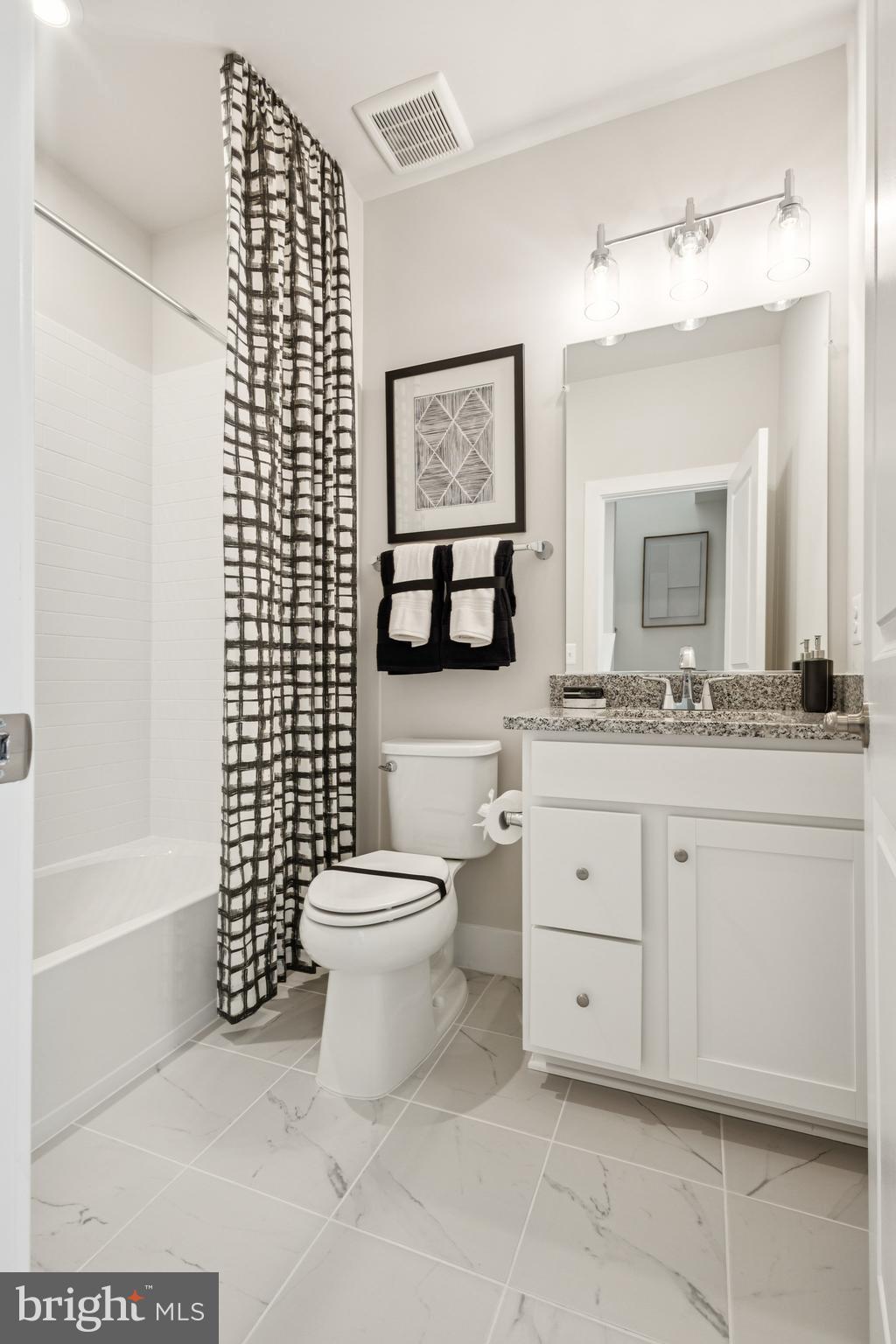 13714 Cobble Loop Woodbridge, VA 22193 - Photo 13 of 27 a bathroom with a toilet sink and mirror