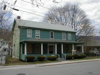 10 Pleasant Street Adams, MA 01220 - Photo 2 of 2 a front view of a house with a garden