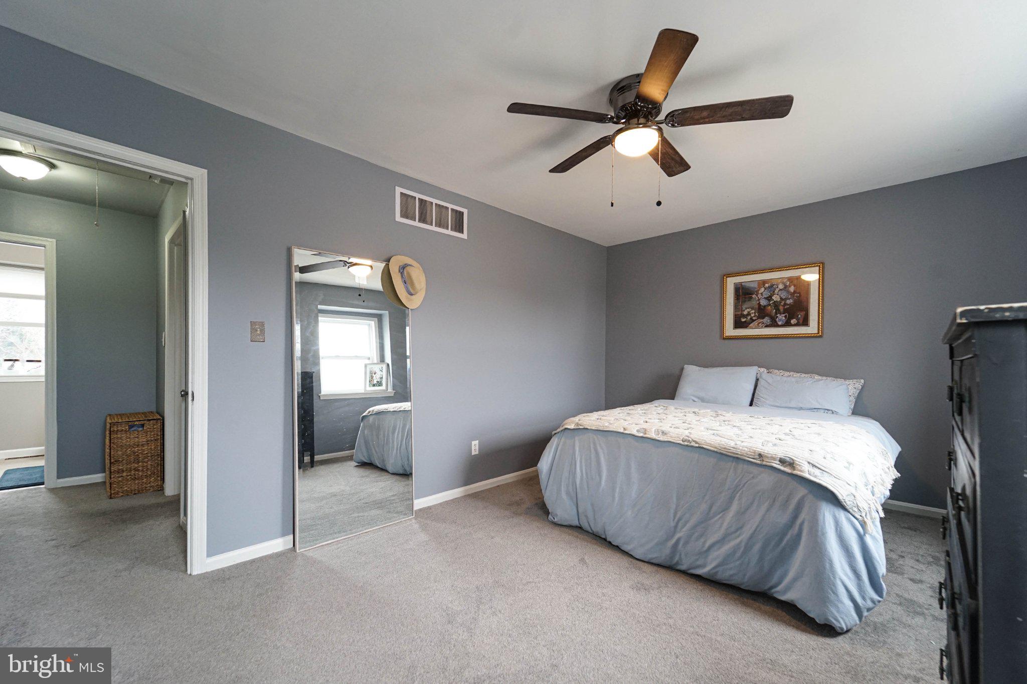 211 Queen Anne Road Stevensville, MD 21666 - Photo 23 of 33 Serene bedroom with calming hues.