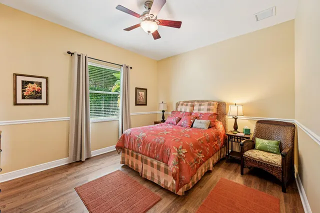 a bedroom with a bed couch and a window