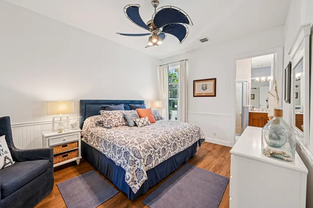 a bedroom with a bed couch and window