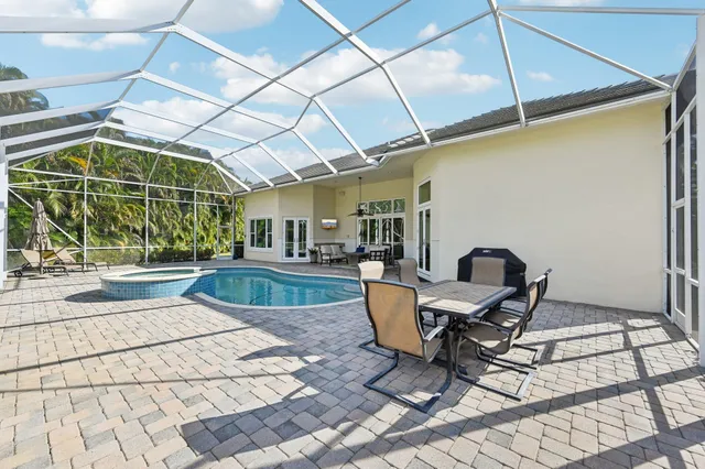 a view of a dining room with a table and chairs