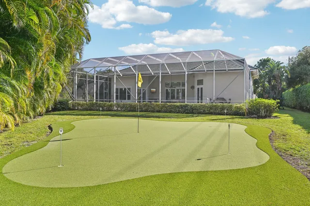 a view of a house with swimming pool and porch