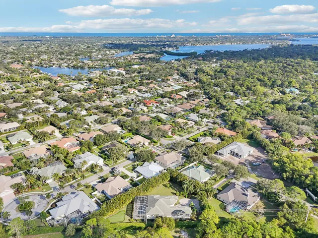 an aerial view of residential building and green space