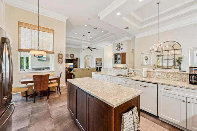 a kitchen with center island table and chairs in it