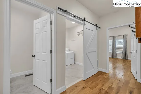 a view of a bathroom from a hallway