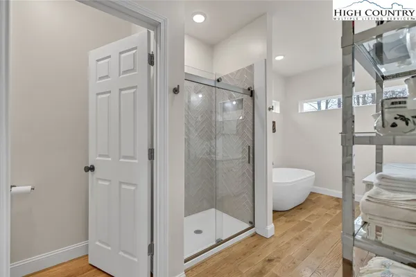 a bathroom with a shower and a toilet