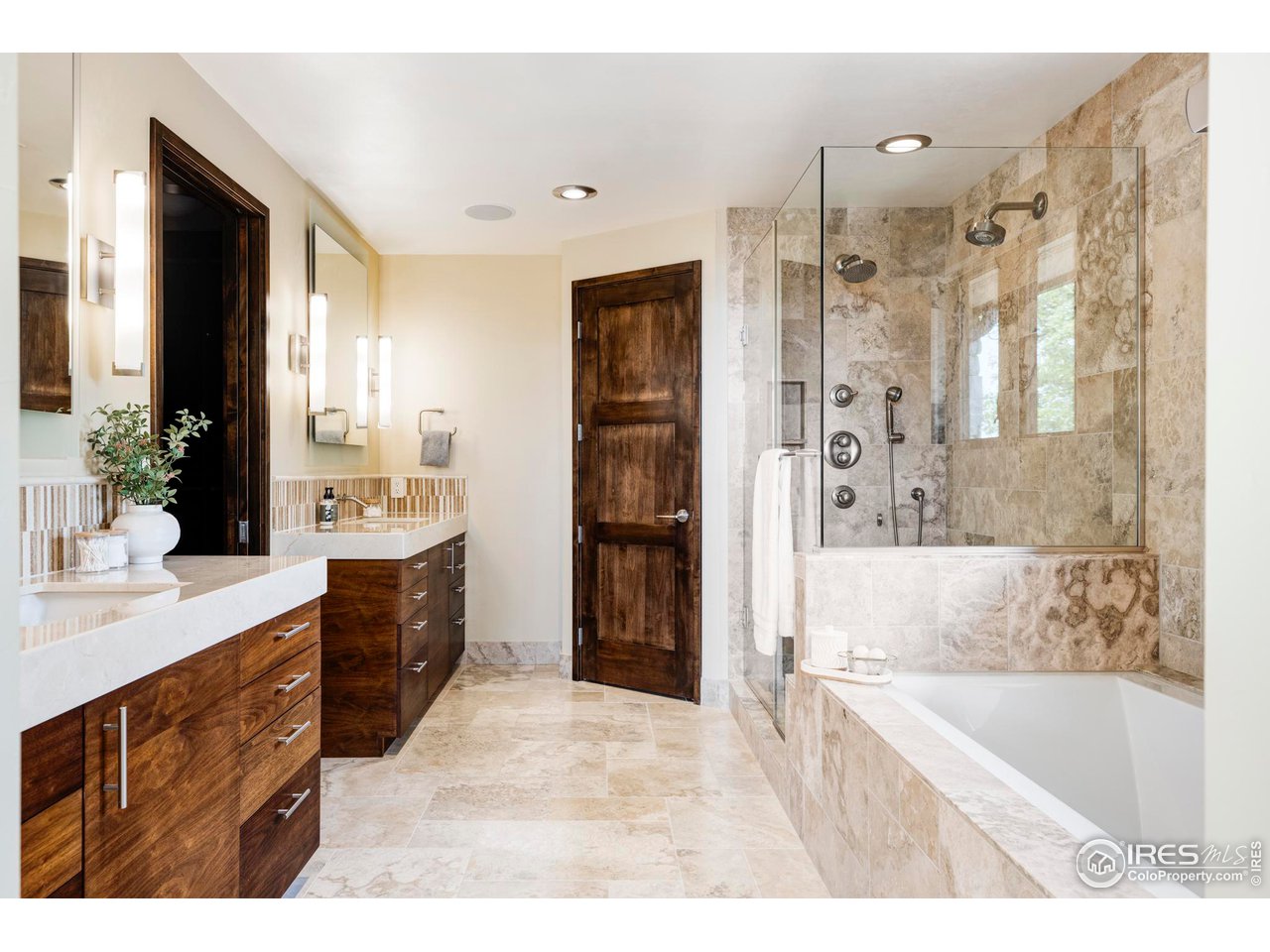 3750 Spring Valley Road Boulder, CO 80304 - Photo 20 of 39 a spacious bathroom with a bathtub sink and mirror