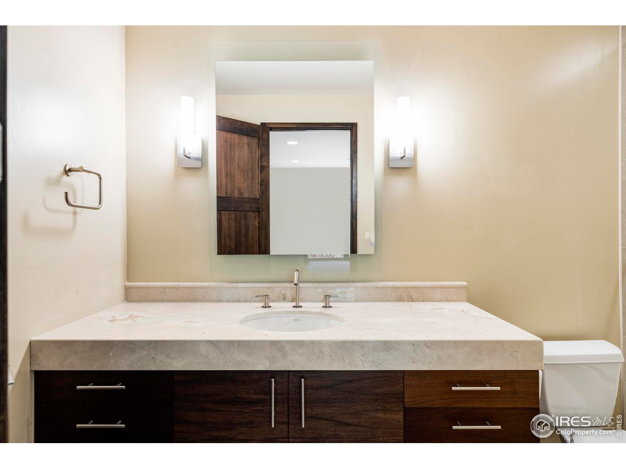 3750 Spring Valley Road Boulder, CO 80304 - Photo 23 of 39 a bathroom with a granite countertop sink a mirror and a toilet