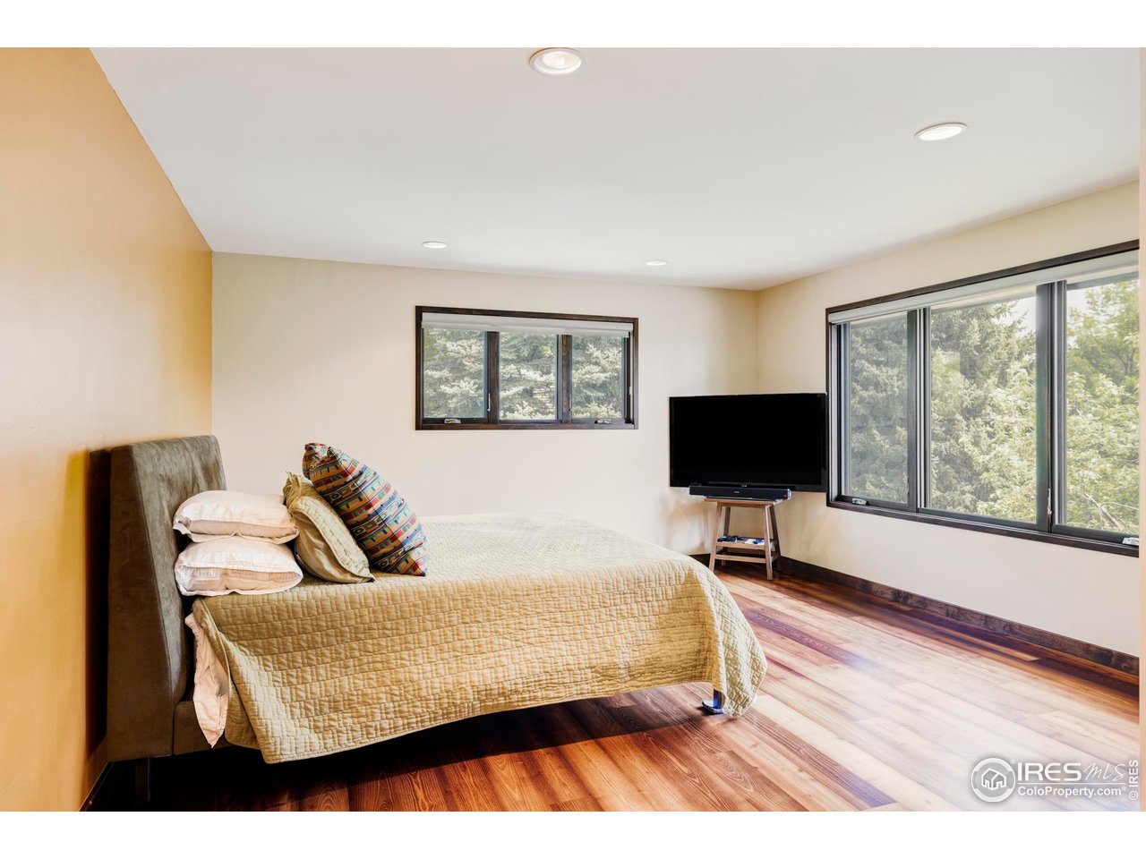 3750 Spring Valley Road Boulder, CO 80304 - Photo 27 of 39 a bedroom with a bed and a flat screen tv