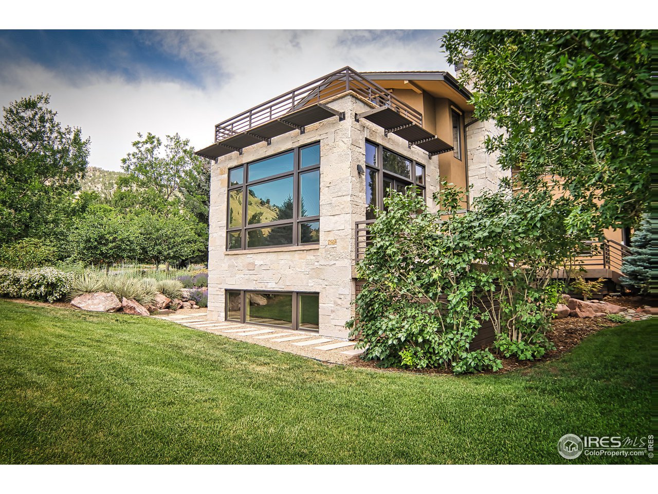 3750 Spring Valley Road Boulder, CO 80304 - Photo 39 of 39 a front view of a house with a garden