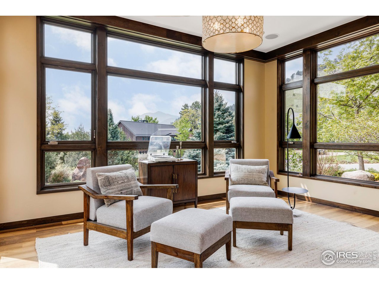 3750 Spring Valley Road Boulder, CO 80304 - Photo 7 of 39 a living room with furniture and a floor to ceiling window