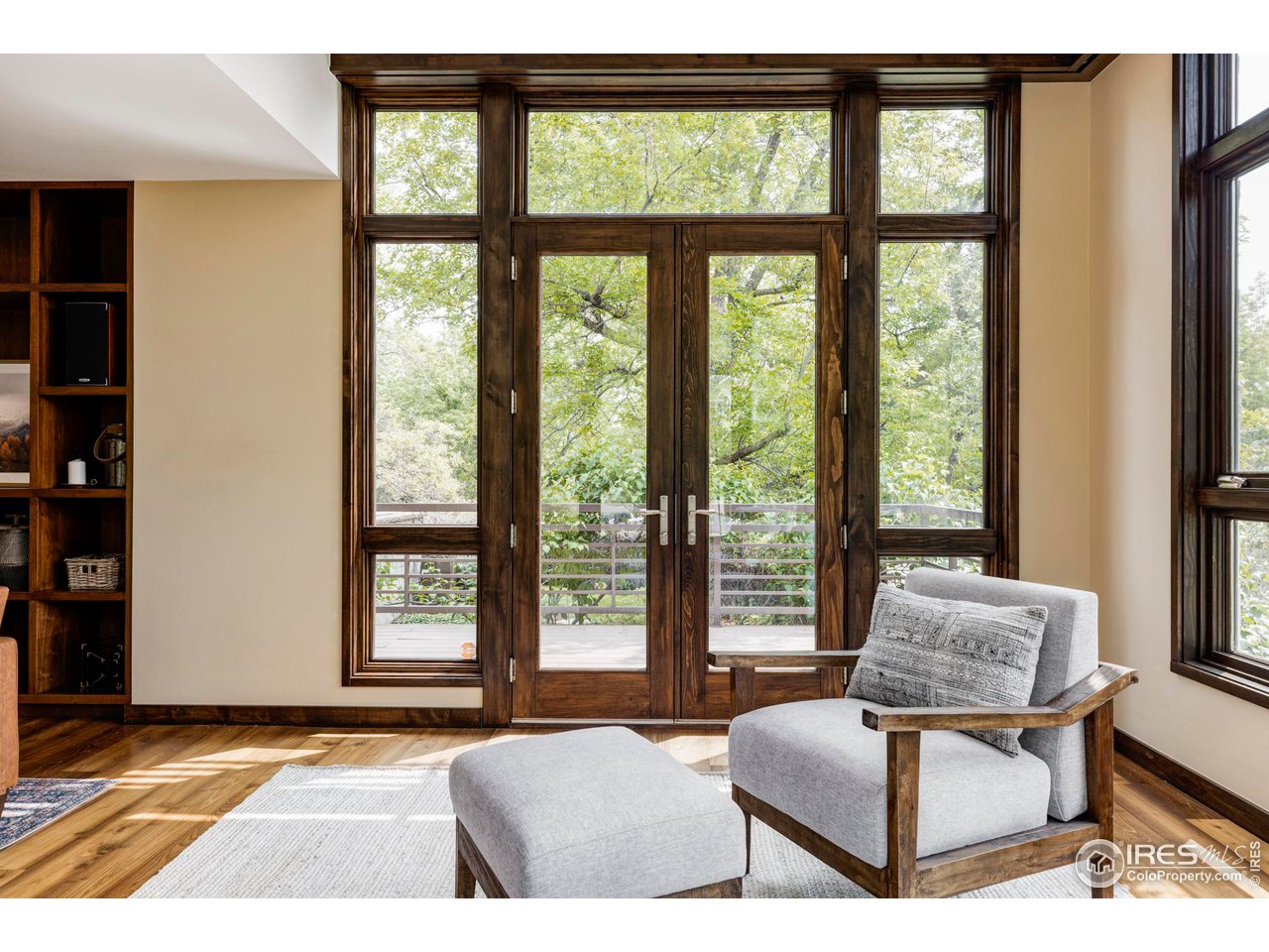 3750 Spring Valley Road Boulder, CO 80304 - Photo 8 of 39 a living room with furniture and a floor to ceiling window