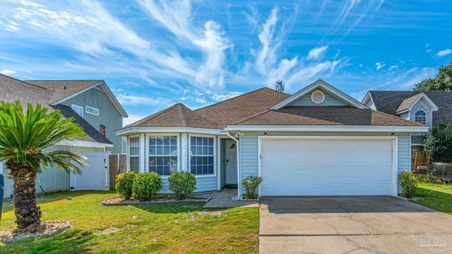 a front view of a house with yard and porch