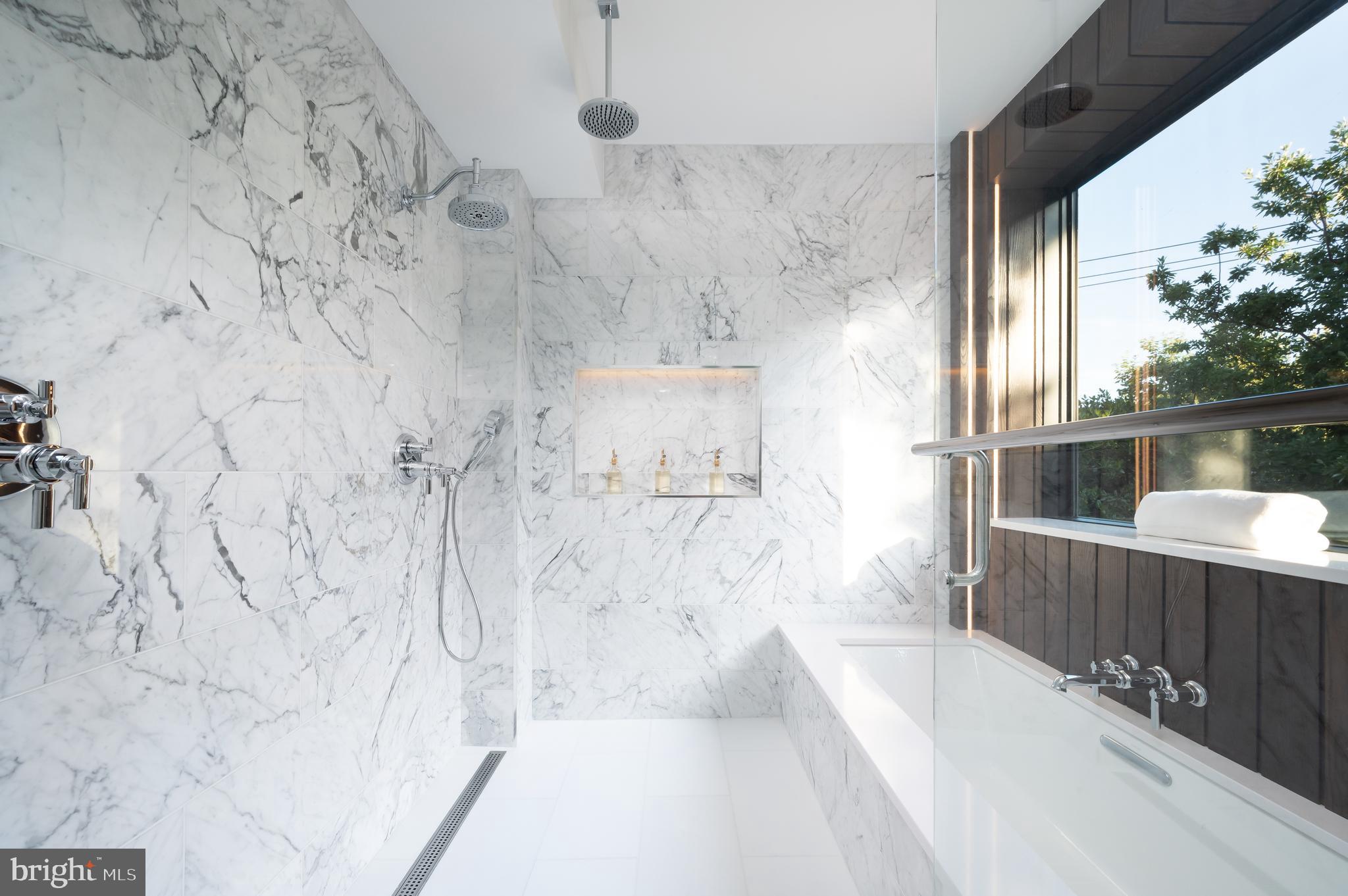 3302 Cleveland Avenue Northwest Washington, DC 20008 - Photo 23 of 54 Primary Windowed 5 fixture marble bathroom